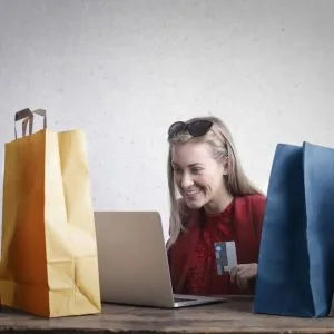 Happy woman shopping online at home